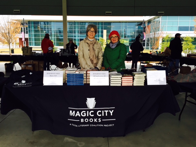 Cindy Hulsey and volunteer Ellen Cummings working at Magic City pop-up table at Tulsa's "Glow on the Green" event.