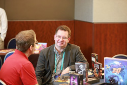 Booksellers talking with board game publishers at Winter Institute