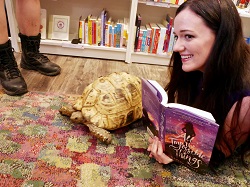 Lindsay Lackey, author of All the Impossible Things, posing with a special guest tortoise.