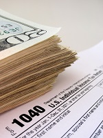 Tax form and $20 bills