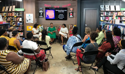 Bookmarks bookstore hosted a Well-Read Black Girl book club with a number of authors; here, attendees at the bookstore watch the authors talk