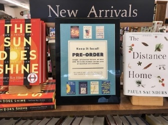 Devaney, Doak and Garrett created a "Keep it local!" sign that reminds customers to pre-order the books listed and get a signed copy.