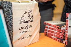 Lark & Owl tote bag among books
