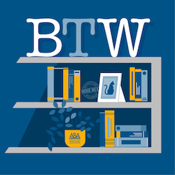 BTW logo on shelving with books and a cat