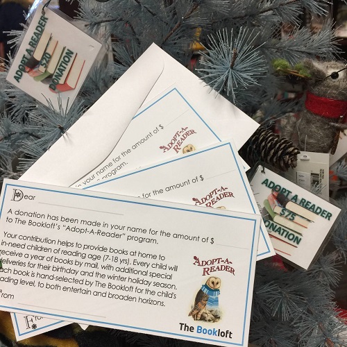 The Adopt-A-Reader informational cards at The Bookloft
