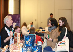 Booksellers perusing board games at Winter Institute