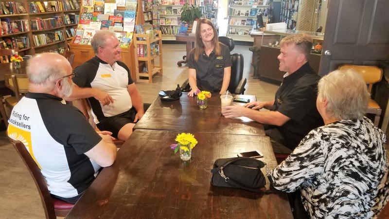 Chuck Robinson and Richard Hunt, left, visited with Jim and Staci Stuart of Stirling Books & Brew in Albion, Michigan, along with Chuck's wife, Dee, at right.