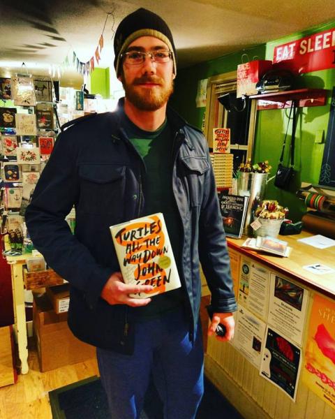 The first customer to pick up a copy of Turtles All the Way Down at Bridgeside Books in Waterbury, Vermont.