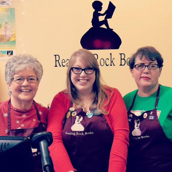 Laura Hill, center, and Amy Jernigan, right, with their mom, Mary Phy, who also works at Reading Rock Books.